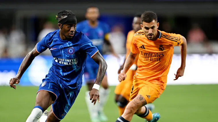 Noni Madueke of Chelsea and Dani Ceballos of Real Madrid