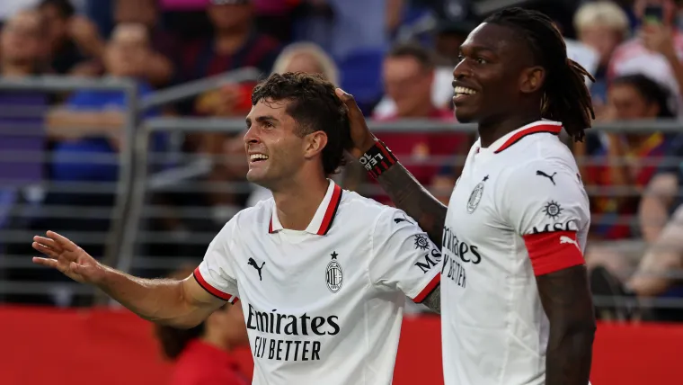 Christian Pulisic and Rafael Leao of AC Milan