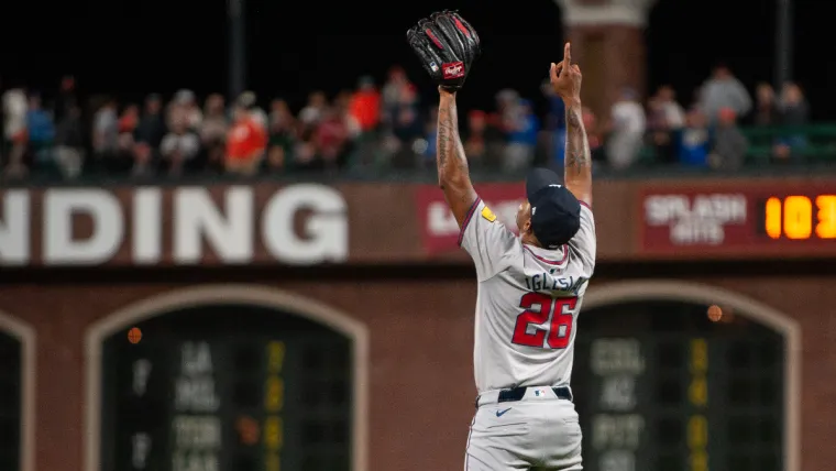 Aug 13, 2024; San Francisco, California, USA; Atlanta Braves pitcher Raisel Iglesias (26) points to the sky after defeating the San Francisco Giants at Oracle Park. Mandatory Credit: Ed Szczepanski-USA TODAY Sports