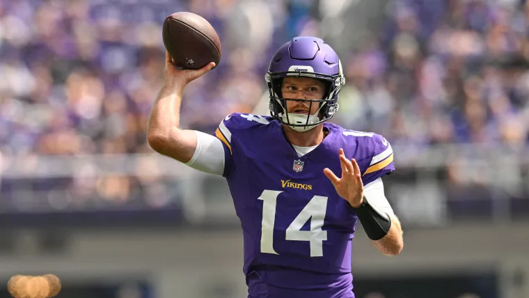 Sam Darnold attempts a pass