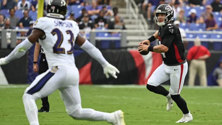 Aug 17, 2024; Baltimore, Maryland, USA; Atlanta Falcons quarterback Taylor Heinicke (4) rolls out to pass as Baltimore Ravens linebacker Trenton Simpson (23) drops into coverage during the first half at M&T Bank Stadium. Mandatory Credit: Tommy Gilligan-USA TODAY Sports