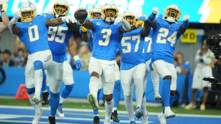 Los Angeles Chargers safety Derwin James Jr. (3) celebrates with linebacker Daiyan Henley (0) and safety AJ Finley (24)