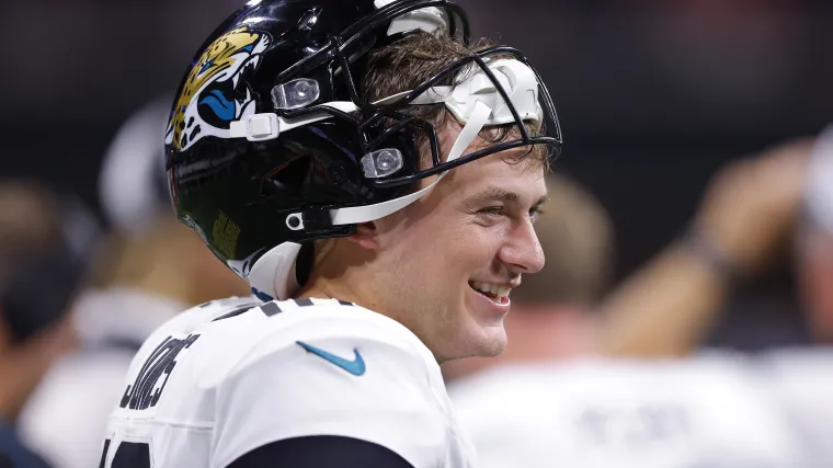 Mac Jones of the Jacksonville Jaguars has a laugh on the sidelines.