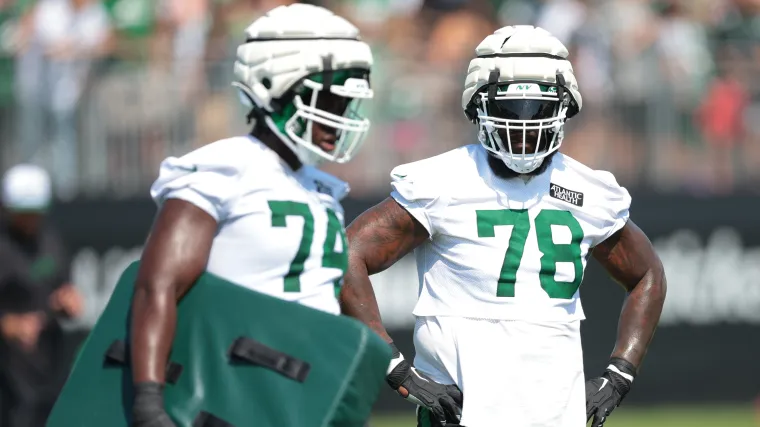 Offensive tackles Olu Fashanu and Morgan Moses