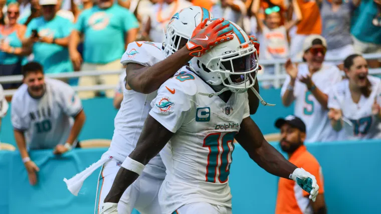 Tyreek Hill and Jaylen Waddle celebrate an 80-yard TD