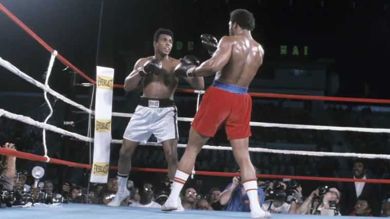 Muhammad Ali trading leather with George Foreman