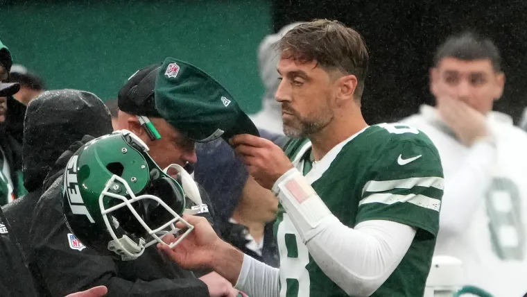 Aaron Rodgers removes helmet