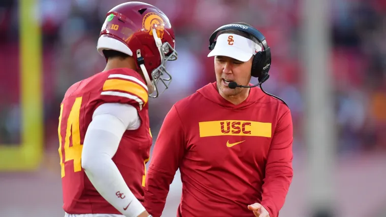 Southern California Trojans head coach Lincoln Riley greets quarterback Jayden Maiava (14) after scoring a touchdown against the Nebraska Cornhuskers during the second half at the Los Angeles Memorial Coliseum.